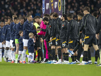 Players shake hands during the Premier League match between Everton and Wolverhampton Wanderers at Goodison Park in Liverpool, England, on D...