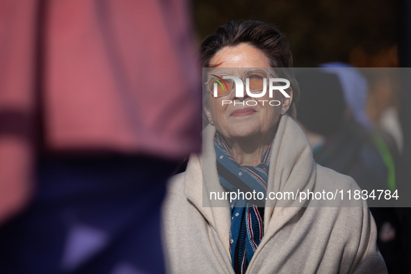 Actor Annette Bening waits as she is introduced to speak at a demonstration outside the Supreme Court, while it hears a case on gender-affir...