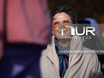 Actor Annette Bening waits as she is introduced to speak at a demonstration outside the Supreme Court, while it hears a case on gender-affir...