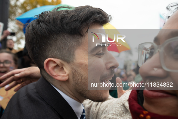 American Civil Liberties Union (ACLU) attorney Chase Strangio receives a hug as he makes his way to speak at a demonstration supporting tran...