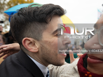 American Civil Liberties Union (ACLU) attorney Chase Strangio receives a hug as he makes his way to speak at a demonstration supporting tran...