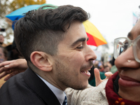 American Civil Liberties Union (ACLU) attorney Chase Strangio receives a hug as he makes his way to speak at a demonstration supporting tran...