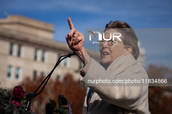 Actor Annette Bening waits as she is introduced to speak at a demonstration outside the Supreme Court in support of gender-affirming care fo...