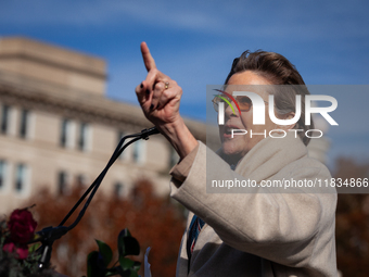 Actor Annette Bening waits as she is introduced to speak at a demonstration outside the Supreme Court in support of gender-affirming care fo...