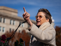 Actor Annette Bening waits as she is introduced to speak at a demonstration outside the Supreme Court in support of gender-affirming care fo...