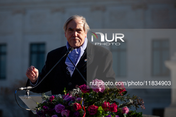 Sen. Jeff Merkley (D-OR) speaks at a demonstration in support of gender-affirming care for transgender children outside the Supreme Court as...