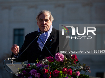 Sen. Jeff Merkley (D-OR) speaks at a demonstration in support of gender-affirming care for transgender children outside the Supreme Court as...