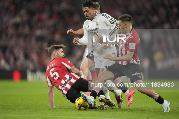 Jude Bellingham central midfield of Real Madrid and England surrounded by Athletic players during the La Liga match between Athletic Club an...