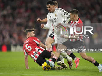 Jude Bellingham central midfield of Real Madrid and England surrounded by Athletic players during the La Liga match between Athletic Club an...