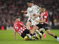 Jude Bellingham central midfield of Real Madrid and England surrounded by Athletic players during the La Liga match between Athletic Club an...