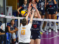 Number 13, Giulia Melli of SMI Roma Volley, and number 13, Lucille Giquel of Chieri '76, are in action during the Serie A1 Tigota match betw...