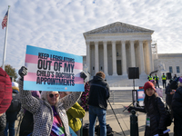 Supporters and opponents of gender-affirming care for transitioning minors are outside the Supreme Court in Washington, D.C., United States,...