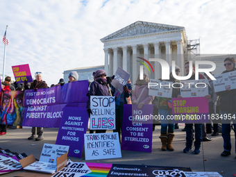 Supporters and opponents of gender-affirming care for transitioning minors are outside the Supreme Court in Washington, D.C., United States,...