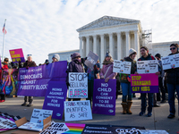 Supporters and opponents of gender-affirming care for transitioning minors are outside the Supreme Court in Washington, D.C., United States,...