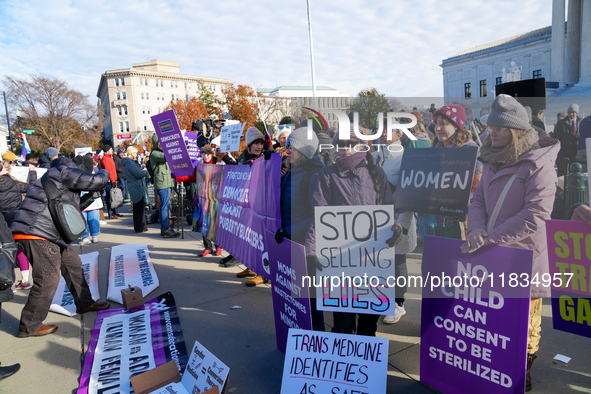 Supporters and opponents of gender-affirming care for transitioning minors are outside the Supreme Court in Washington, D.C., United States,...