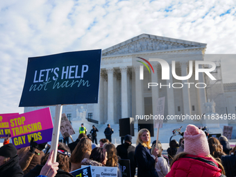 Supporters and opponents of gender-affirming care for transitioning minors are outside the Supreme Court in Washington, D.C., United States,...