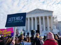 Supporters and opponents of gender-affirming care for transitioning minors are outside the Supreme Court in Washington, D.C., United States,...