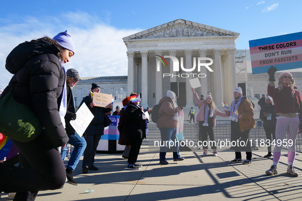 Supporters and opponents of gender-affirming care for transitioning minors are outside the Supreme Court in Washington, D.C., United States,...