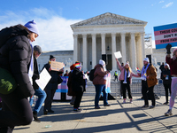 Supporters and opponents of gender-affirming care for transitioning minors are outside the Supreme Court in Washington, D.C., United States,...