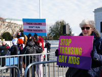 Supporters and opponents of gender-affirming care for transitioning minors are outside the Supreme Court in Washington, D.C., United States,...