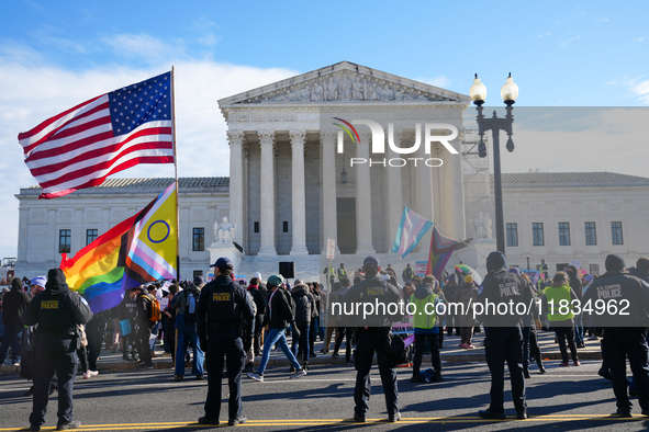 Supporters and opponents of gender-affirming care for transitioning minors are outside the Supreme Court in Washington, D.C., United States,...