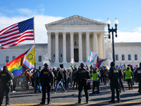 Supporters and opponents of gender-affirming care for transitioning minors are outside the Supreme Court in Washington, D.C., United States,...