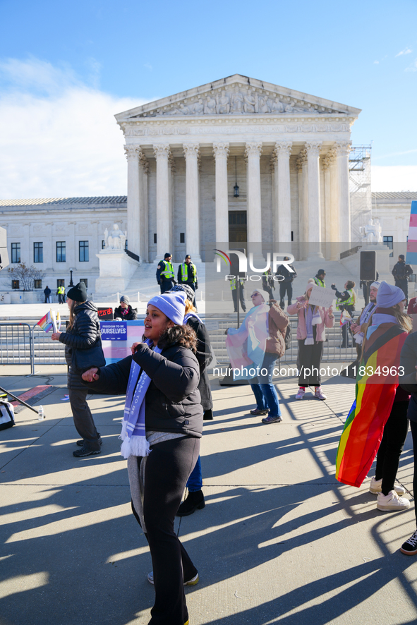 Supporters and opponents of gender-affirming care for transitioning minors are outside the Supreme Court in Washington, D.C., United States,...