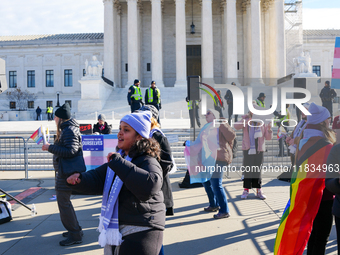 Supporters and opponents of gender-affirming care for transitioning minors are outside the Supreme Court in Washington, D.C., United States,...