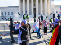 Supporters and opponents of gender-affirming care for transitioning minors are outside the Supreme Court in Washington, D.C., United States,...