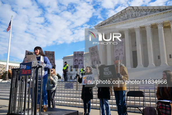 Supporters and opponents of gender-affirming care for transitioning minors are outside the Supreme Court in Washington, D.C., United States,...