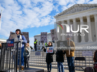 Supporters and opponents of gender-affirming care for transitioning minors are outside the Supreme Court in Washington, D.C., United States,...