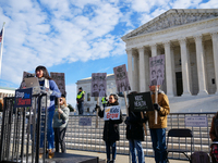 Supporters and opponents of gender-affirming care for transitioning minors are outside the Supreme Court in Washington, D.C., United States,...