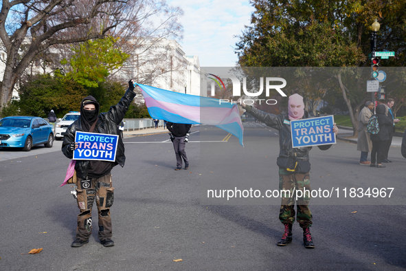 Supporters and opponents of gender-affirming care for transitioning minors are outside the Supreme Court in Washington, D.C., United States,...