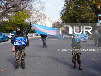 Supporters and opponents of gender-affirming care for transitioning minors are outside the Supreme Court in Washington, D.C., United States,...