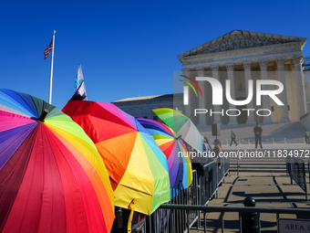 Supporters and opponents of gender-affirming care for transitioning minors are outside the Supreme Court in Washington, D.C., United States,...