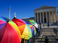 Supporters and opponents of gender-affirming care for transitioning minors are outside the Supreme Court in Washington, D.C., United States,...