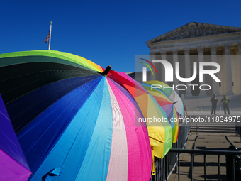 Supporters and opponents of gender-affirming care for transitioning minors are outside the Supreme Court in Washington, D.C., United States,...