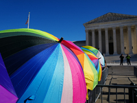 Supporters and opponents of gender-affirming care for transitioning minors are outside the Supreme Court in Washington, D.C., United States,...