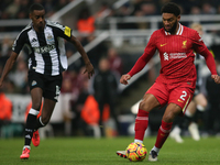 Liverpool's Joe Gomez is under pressure from Newcastle United's Alexander Isak during the Premier League match between Newcastle United and...