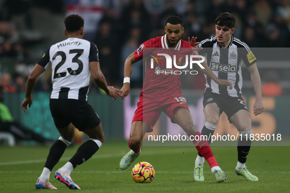 Liverpool's Cody Gakpo takes on Newcastle United's Tino Livramento during the Premier League match between Newcastle United and Liverpool at...