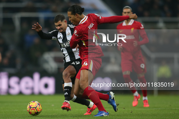 Liverpool's Virgil van Dijk fouls Newcastle United's Bruno Guimaraes during the Premier League match between Newcastle United and Liverpool...