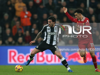 Sandro Tonali of Newcastle United holds off Curtis Jones of Liverpool during the Premier League match between Newcastle United and Liverpool...