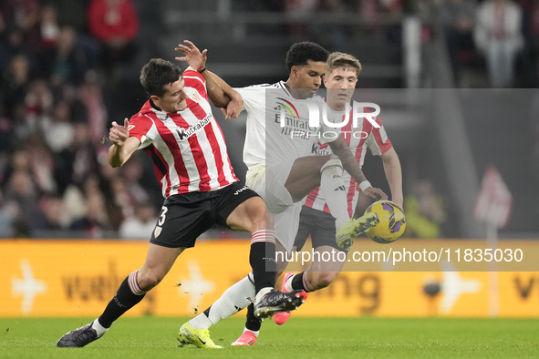 Rodrygo Goes right winger of Real Madrid and Brazil and Dani Vivian centre-back of Athletic Club and Spain compete for the ball during the L...