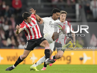 Rodrygo Goes right winger of Real Madrid and Brazil and Dani Vivian centre-back of Athletic Club and Spain compete for the ball during the L...