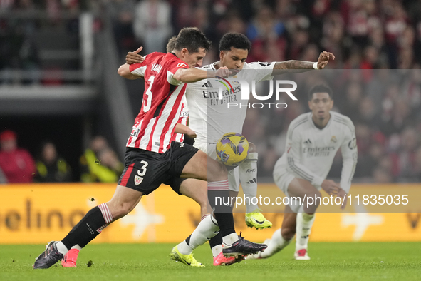 Rodrygo Goes right winger of Real Madrid and Brazil and Dani Vivian centre-back of Athletic Club and Spain compete for the ball during the L...