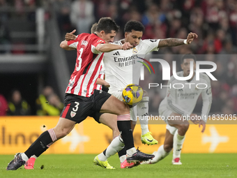 Rodrygo Goes right winger of Real Madrid and Brazil and Dani Vivian centre-back of Athletic Club and Spain compete for the ball during the L...