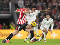 Rodrygo Goes right winger of Real Madrid and Brazil and Dani Vivian centre-back of Athletic Club and Spain compete for the ball during the L...