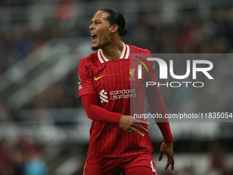 Liverpool's Virgil van Dijk plays during the Premier League match between Newcastle United and Liverpool at St. James's Park in Newcastle, U...