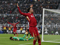 Curtis Jones celebrates Liverpool's first goal during the Premier League match between Newcastle United and Liverpool at St. James's Park in...