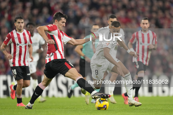 Kylian Mbappe centre-forward of Real Madrid and France and Dani Vivian centre-back of Athletic Club and Spain compete for the ball during th...